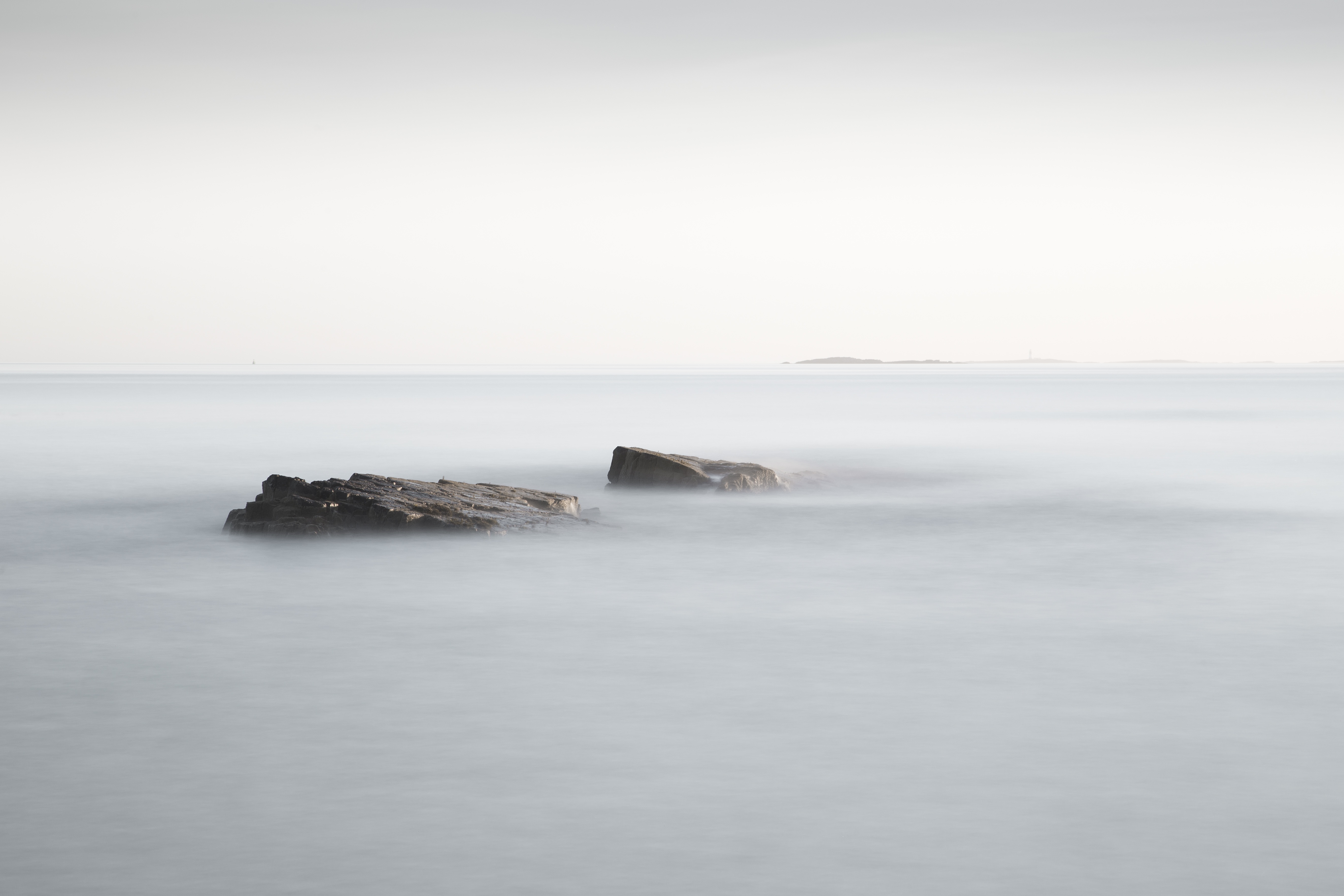 Rocks emerging through clouds symbolising stillness, strength, and stability in Tai Chi standing practice.